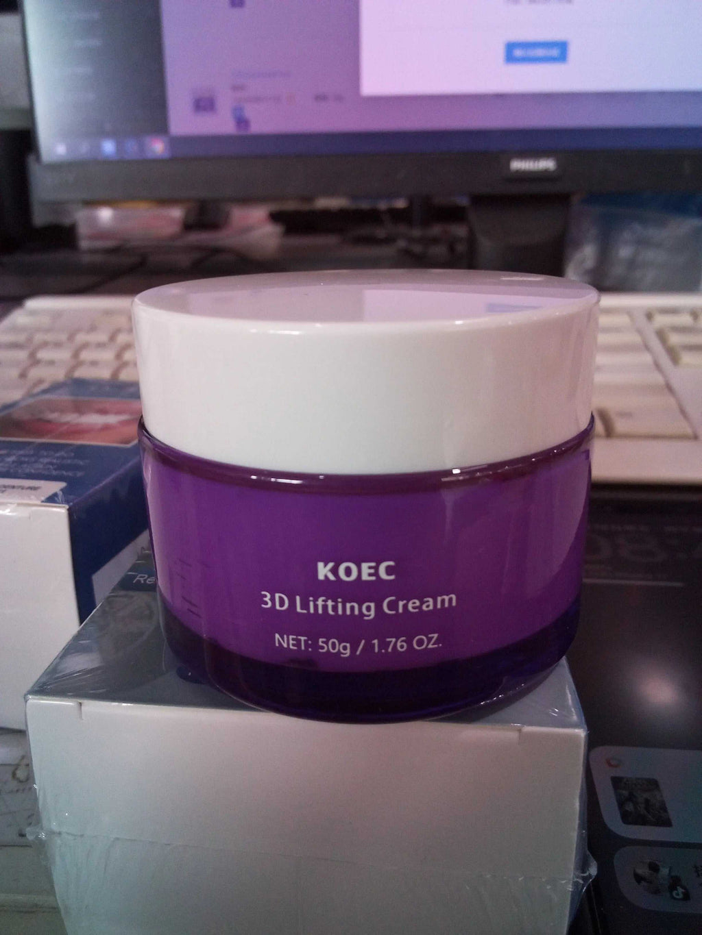 Product packaging of KOEC 3D Lifting Cream with purple jar and box, highlighting key ingredients like lactobacillus and shea butter